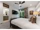 Bedroom with large windows, a ceiling fan, and an ensuite bathroom with a modern aesthetic at 460 E 33Rd St, Charlotte, NC 28205