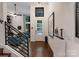 Inviting entryway boasts hardwood floors and modern accents, flowing seamlessly into the adjacent living space at 460 E 33Rd St, Charlotte, NC 28205