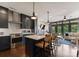 Stylish kitchen with navy cabinets, stainless steel appliances, and a center island open to the living area at 460 E 33Rd St, Charlotte, NC 28205
