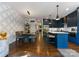 Modern kitchen with blue cabinets, stainless steel appliances, white countertops, and stylish lighting fixtures at 460 E 33Rd St, Charlotte, NC 28205