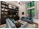 Bright living room featuring custom built-ins, modern decor, and large windows at 460 E 33Rd St, Charlotte, NC 28205
