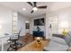 Comfortable living room showcasing a plush sofa, hardwood floors, modern lighting, and a sleek entertainment center at 460 E 33Rd St, Charlotte, NC 28205