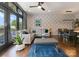 Bright living room featuring a comfortable sectional sofa, stylish decor, and access to the outdoor balcony at 460 E 33Rd St, Charlotte, NC 28205