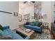 Bright living room with high ceilings, elegant decor, and open staircase at 460 E 33Rd St, Charlotte, NC 28205