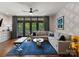 Cozy living room offers stylish decor, ample seating, and natural light from the sliding glass doors at 460 E 33Rd St, Charlotte, NC 28205