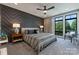 Stylish main bedroom with textured accent wall and abundant natural light at 460 E 33Rd St, Charlotte, NC 28205