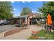 Restaurant exterior with outdoor seating, brick facade, and ample parking at 460 E 33Rd St, Charlotte, NC 28205