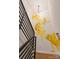 Unique stairwell with modern railing and a charming mural of swimming goldfish at 460 E 33Rd St, Charlotte, NC 28205