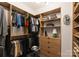 Well-organized walk-in closet with custom wood shelving and ample storage space at 460 E 33Rd St, Charlotte, NC 28205