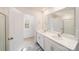 Bathroom featuring double sinks, white cabinets, and a large framed mirror at 462 Janie Cir # 100, Newton, NC 28658