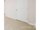 Bright bedroom with neutral carpet features a painted panel door at 462 Janie Cir # 100, Newton, NC 28658
