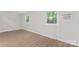 Bedroom featuring wood-look flooring, natural light from windows, and air conditioner at 5534 Great Wagon Rd, Charlotte, NC 28215