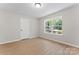 Bright bedroom with a large window for natural light and wood flooring at 5534 Great Wagon Rd, Charlotte, NC 28215