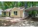 The home's exterior features a carport and nicely landscaped lawn, creating a welcoming curb appeal at 5534 Great Wagon Rd, Charlotte, NC 28215