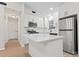Renovated kitchen featuring white cabinets, stainless appliances, quartz countertops and eat-in island at 5534 Great Wagon Rd, Charlotte, NC 28215