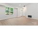 The living room is bright and inviting, featuring an entryway view and wood-look flooring at 5534 Great Wagon Rd, Charlotte, NC 28215