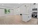 Bright open floor plan with an eat-in kitchen, stainless steel appliances, and a large window at 5534 Great Wagon Rd, Charlotte, NC 28215