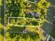 An aerial view showcases the property and its surrounding landscape, with the lake and lush trees at 584 Williamson Rd, Mooresville, NC 28117