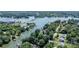 Scenic aerial shot of waterfront property featuring a serene lake view with surrounding trees and docks at 584 Williamson Rd, Mooresville, NC 28117