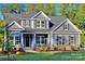 Charming two-story home featuring a well-manicured lawn and inviting entrance at 584 Williamson Rd, Mooresville, NC 28117