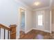 Welcoming foyer with hardwood floors and staircase at 584 Williamson Rd, Mooresville, NC 28117