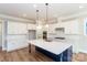 Modern kitchen with large island, stainless steel appliances, and ample cabinet space at 584 Williamson Rd, Mooresville, NC 28117