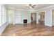 Spacious living room with hardwood floors, fireplace, and custom built-in shelving at 584 Williamson Rd, Mooresville, NC 28117