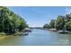 Expansive waterfront view showcasing a boat dock and lake access at 584 Williamson Rd, Mooresville, NC 28117