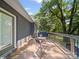 Back deck with table, chairs, and a grill perfect for relaxation and outdoor enjoyment at 6616 Love Mill Rd, Monroe, NC 28110