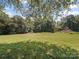 Large, level backyard perfect for outdoor activities, offering plenty of green space at 6616 Love Mill Rd, Monroe, NC 28110