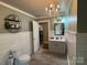 Bathroom featuring a toilet, vanity, and updated fixtures for a spa-like experience at 6616 Love Mill Rd, Monroe, NC 28110