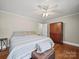 Bright bedroom with a queen bed, wood floors, and a spacious armoire at 6616 Love Mill Rd, Monroe, NC 28110