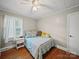 Comfortable bedroom with hardwood floors, a ceiling fan, and natural light at 6616 Love Mill Rd, Monroe, NC 28110