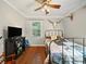 Cozy bedroom with hardwood floors, natural light, and a rustic decorative style at 6616 Love Mill Rd, Monroe, NC 28110