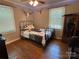 Bedroom with hardwood floors, vintage decor, and an exposed beam ceiling adds character and charm at 6616 Love Mill Rd, Monroe, NC 28110