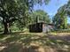 View of brick home with a charming, covered front porch surrounded by a well-maintained lawn at 6616 Love Mill Rd, Monroe, NC 28110