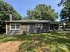 Beautiful brick home with brown shutters and a stone front porch at 6616 Love Mill Rd, Monroe, NC 28110