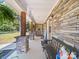 Inviting front porch with stone columns, stone wall, and cozy seating area at 6616 Love Mill Rd, Monroe, NC 28110