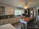 Bright kitchen featuring a large dining table, updated appliances, and generous countertop space at 6616 Love Mill Rd, Monroe, NC 28110