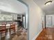 Spacious kitchen area with white cabinetry, tile floors, stainless steel appliances, and a large dining table at 6616 Love Mill Rd, Monroe, NC 28110