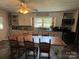 Eat-in kitchen featuring a large dining table, neutral countertops, and ample natural light at 6616 Love Mill Rd, Monroe, NC 28110