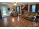 Spacious living room with wood floors, fireplace, and plenty of seating for Gathering and guests at 6616 Love Mill Rd, Monroe, NC 28110