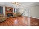 Welcoming living room featuring a cozy fireplace, hardwood floors, and ample seating at 6616 Love Mill Rd, Monroe, NC 28110