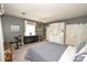 Spacious bedroom with built-in shelving, a large window, and neutral carpeting at 711 Yadkin St, Albemarle, NC 28001