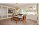 Elegant dining room with modern chandelier, neutral carpet, and built-in display cabinets at 711 Yadkin St, Albemarle, NC 28001