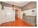 Traditional foyer with hardwood flooring, white wainscoting, and a charming sideboard with decorative accents at 711 Yadkin St, Albemarle, NC 28001