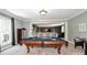 Finished game room with a pool table, an air hockey table, recessed lighting, and custom shelving at 711 Yadkin St, Albemarle, NC 28001