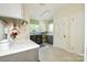 Convenient laundry room with modern washer/dryer, plenty of counter space, and tiled floors at 711 Yadkin St, Albemarle, NC 28001