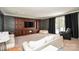 Entertainment room with custom built-ins, recessed lighting, and a walkout to the patio at 711 Yadkin St, Albemarle, NC 28001