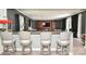 Spacious entertainment room with a wet bar, swivel chairs, and recessed lighting at 711 Yadkin St, Albemarle, NC 28001